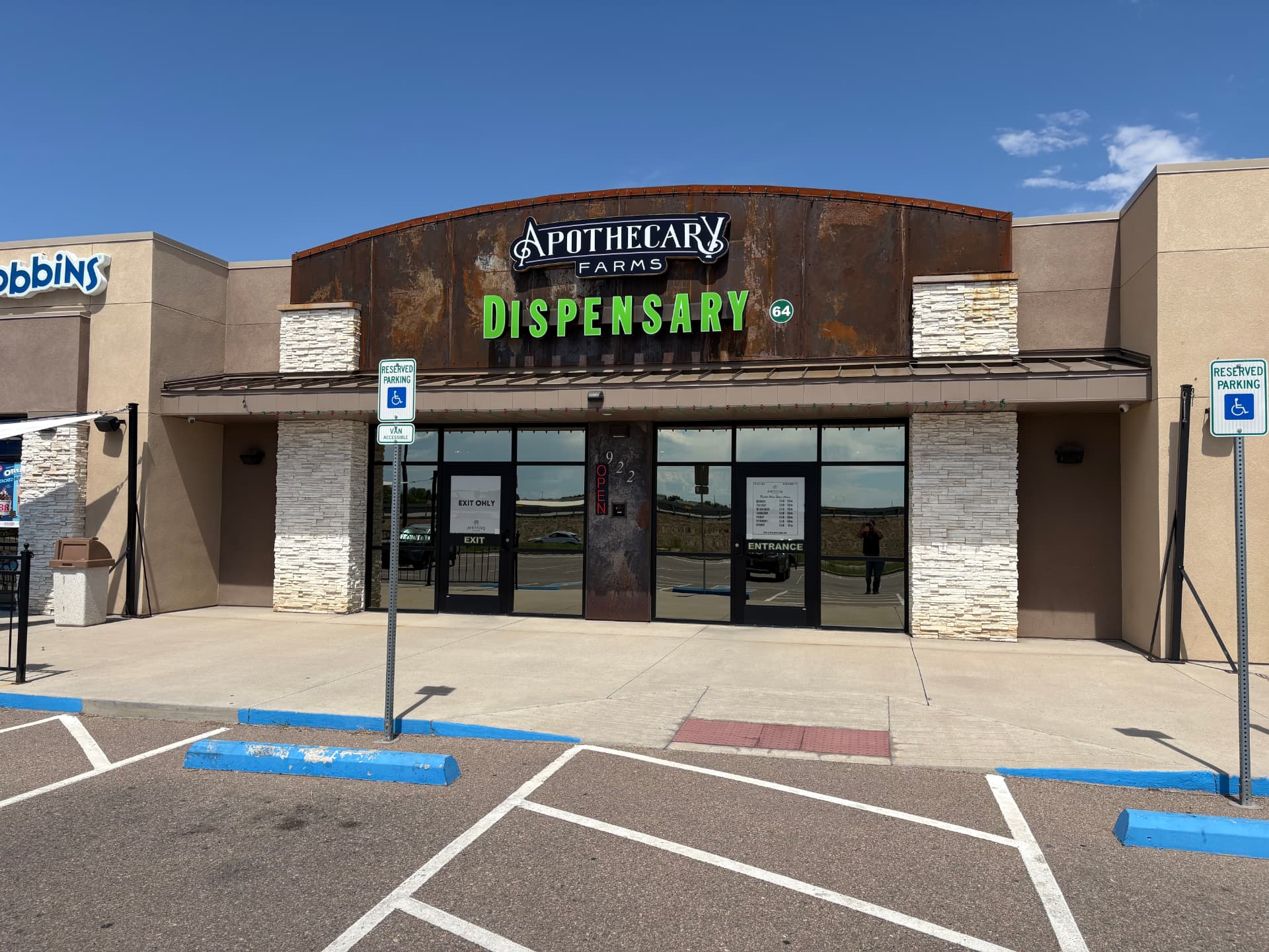 Apothecary Farms Pueblo West dispensary storefront with rustic metal sign