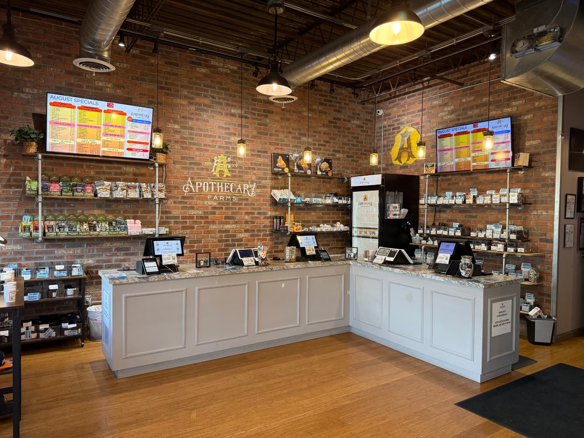 Apothecary Farms Delta Drive sales floor with brick walls, digital menus and display counters