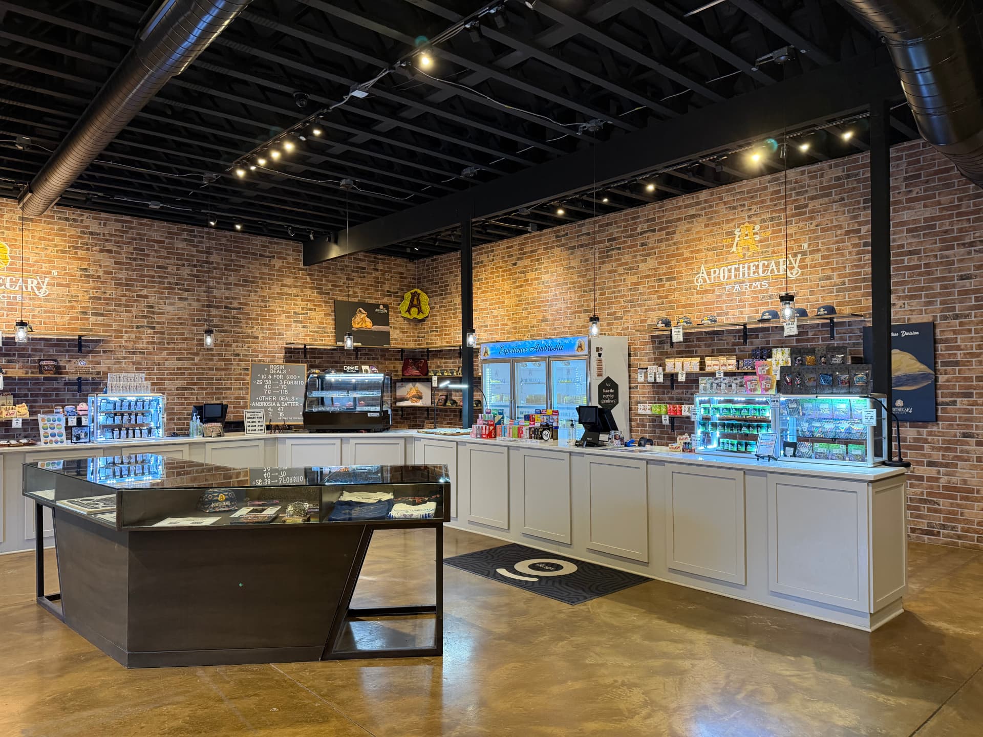 Apothecary Farms North May sales floor with brick walls, display cases and Ambrosia fridge