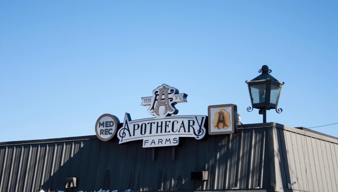 Apothecary Farms Pueblo dispensary rooftop sign on Santa Fe Drive with MED and REC badge
