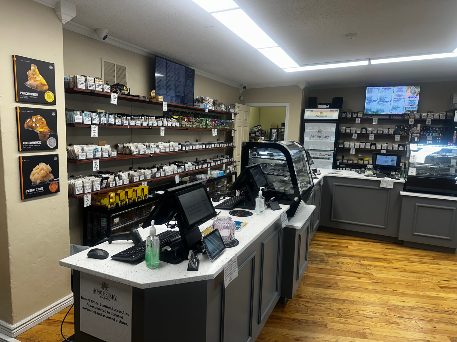 Apothecary Farms Colorado Avenue sales floor with shelves, terp fridge and digital menus
