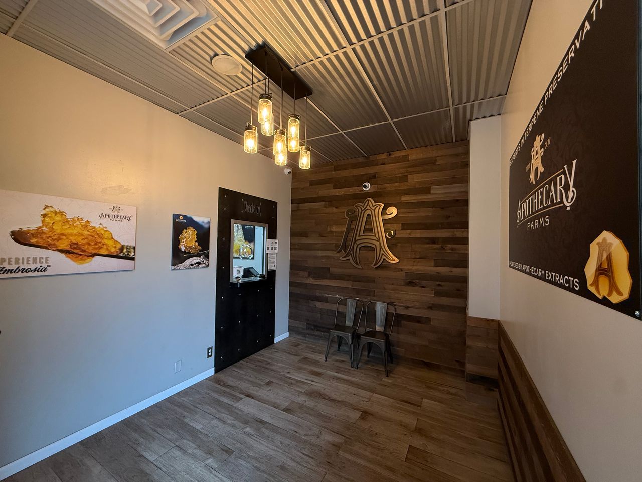 Apothecary Farms South Broadway lobby with wood accent wall and AF monogram